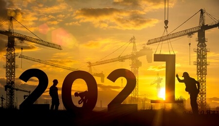 silhouette construction site,cranes building construction 2021 year sign