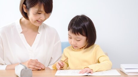 asian girl studying in the living room