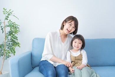 asian mom and daughter spending time indoors