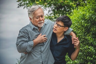 the son helped support his father who felt heart pain