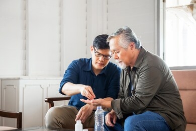 middle aged son takes care of sick senior father, happiness asian family concepts