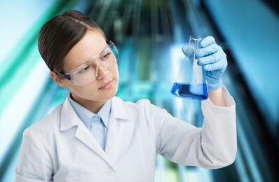 laboratory researcher holding medical glass bottle with liquid wearing sterile gloves