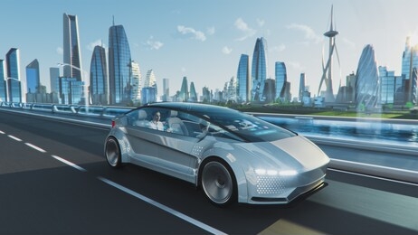 shot of a futuristic self-driving van moving on a public highway in a modern city with glass skyscrapers. beautiful female and senior man are having a conversation in a driverless autonomous vehicle.