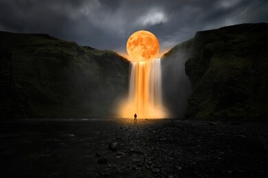 orange moon over great waterfall