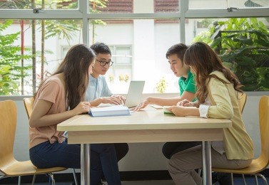 asian students working in the library.