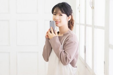 young woman with a smartphone shot in the studio