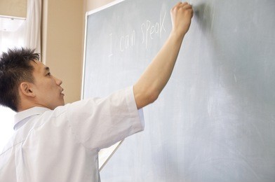 teacher to write a problem on the blackboard