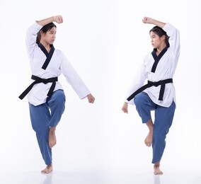 master black belt taekwondo karate national athlete young teenager show traditional fighting poses poomse in sport dress, studio lighting white background isolated, motion blur on foots hands