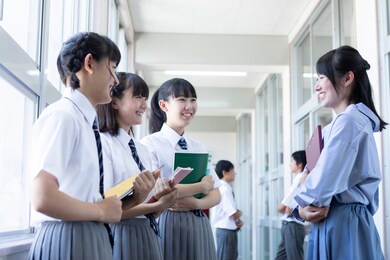 junior high school students talking in the corridor
