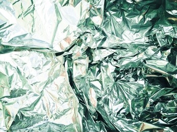 crumpled aluminum foil.metallic silver foil texture. shiny backdrop. foil.
