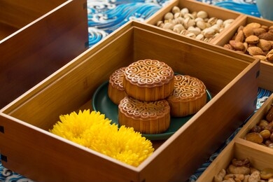 inside the box are chrysanthemum and moon cakes