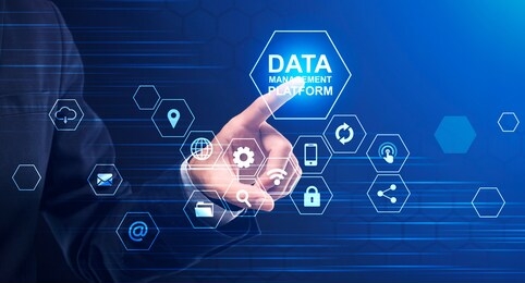 data management platform. creative collage of businessman pressing button on screen with multimedia icons