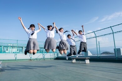 junior high school students jumping on the roof