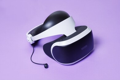 glasses of virtual reality. augmented reality, future technology concept. vr. bright trendy purple background. free space for text. top view.
