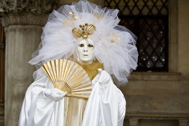 white and gold costume at the venice carnival