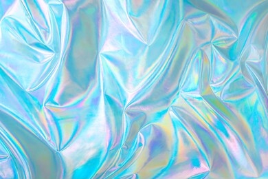 abstract modern pastel colored holographic background in 80s style. crumpled iridescent foil textile real texture. synthwave. vaporwave style. retrowave, retro futurism, webpunk