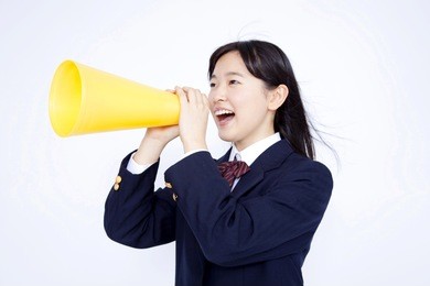japanese middle school girl screaming through a megaphone