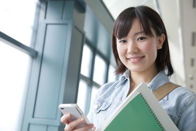 a japanese student with a smartphone,