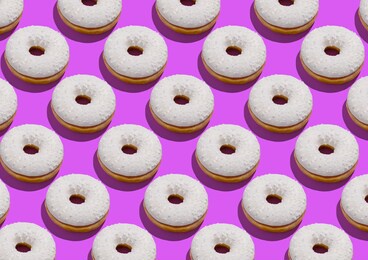 delicious donuts with white sugary icing and sprinkles flat lay on neon purple background, creative repeat design, geometric pattern, top view