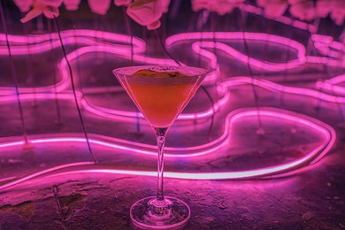 fancy pink cocktail in neon light