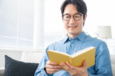 asian middle age man who reads a book