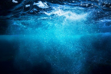 sea bottom with blue water wave splash background