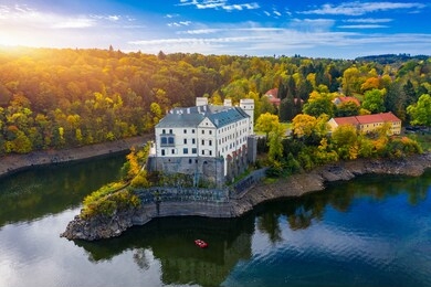 aerial view chateau orlik, above orlik reservoir in beautiful autumn nature. romantic royal schwarzenberg castle above water level. czechia. orlik castle across the river vltava, czech republic.