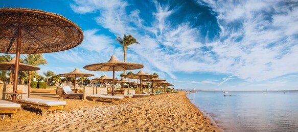 relax under parasol on the beach of red sea, egypt