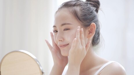 young woman doing skin care