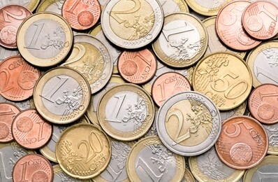 various euro coins for business, money, financial, cash, currency and economy concept. pile of 1 euro coin, 1 cent coin, small, change of different european countries of the world for background.