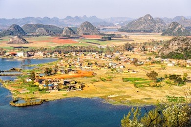 the puzhehei county under the sunset in yunnan province of china.