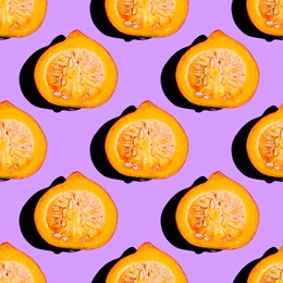 creative seamless food pattern of halved orange pumpkin on neon purple background. conceptual modern photography collage