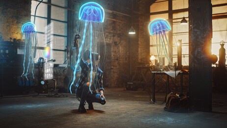 female artist wearing augmented reality headset working on abstract 3d jellyfish sculpture with joysticks, uses gestures to create high-tech internet multimedia concept art.3d animation special effect