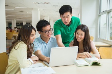 asian students working in the library.