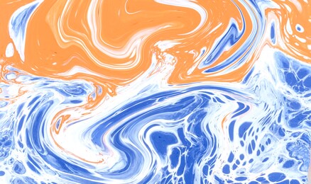 hand painted background with mixed liquid ink colorful paints. abstract fluid acrylic painting. marbled blue and orange abstract background. liquid marble pattern.
