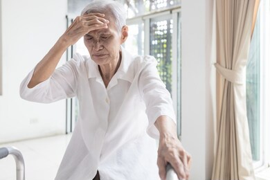 exhausted asian senior woman is touching her head with hand,symptoms of vertigo illness,loss balance dizzy,meniere’s disease,feel unwell faint,sick elderly people having a  headache,health problem