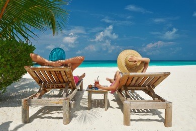 couple on a tropical beach at maldives
