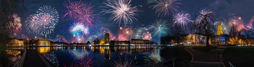 panoramic view of kiel skyline, kiel opera house, the town hall by kleiner kiel by night with firework.  fireworks over kiel, schleswig-holstein, germany
