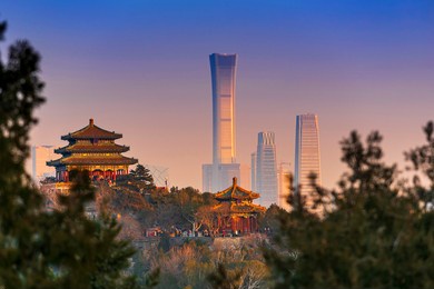 sunset beijing cityscape between ancient chinese architecture. historic buildings and  beijing modern building with sweet sun rise sky, beijing, china
