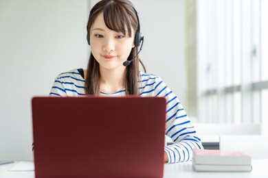 asian female student taking online class. e-learning. remote work.