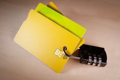 padlock and several credit cards, concept of online payment, financial instruments and credit card data security and encryption