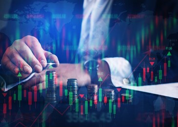 businessman holding coin with graph. double exposure of financial graph. forex investment business.