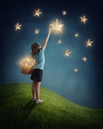 little girl  trying to catch a star