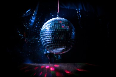 colorful disco mirror ball lights night club background. party lights disco ball. selective focus