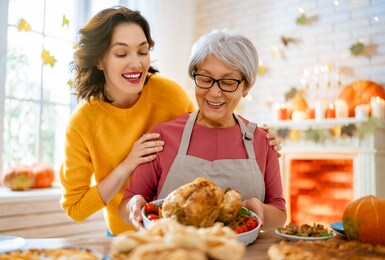 happy thanksgiving day! autumn feast. family preparing traditional dinner.