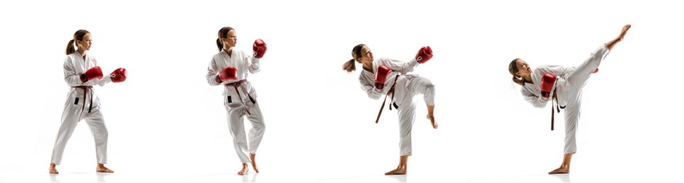 target. junior in kimono practicing taekwondo combat, martial arts. young female fighter with red gloves training on white studio background in motion, dymanic. concept of healthy lifestyle, action.