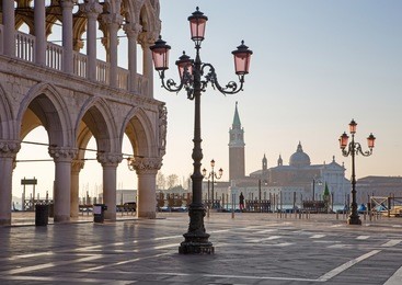 venice - doge palace and saint mark square and san giorgio maggiore church in background in morning light.