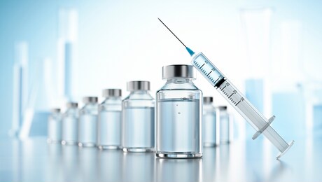 influenza vaccine concept with syringe and bottles of vial with copy space  - 3d illustration