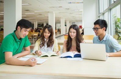 asian students working in the library.