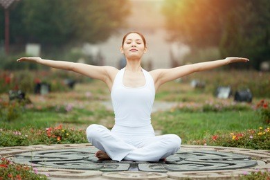 asia yoga instructor, in outdoor exercise